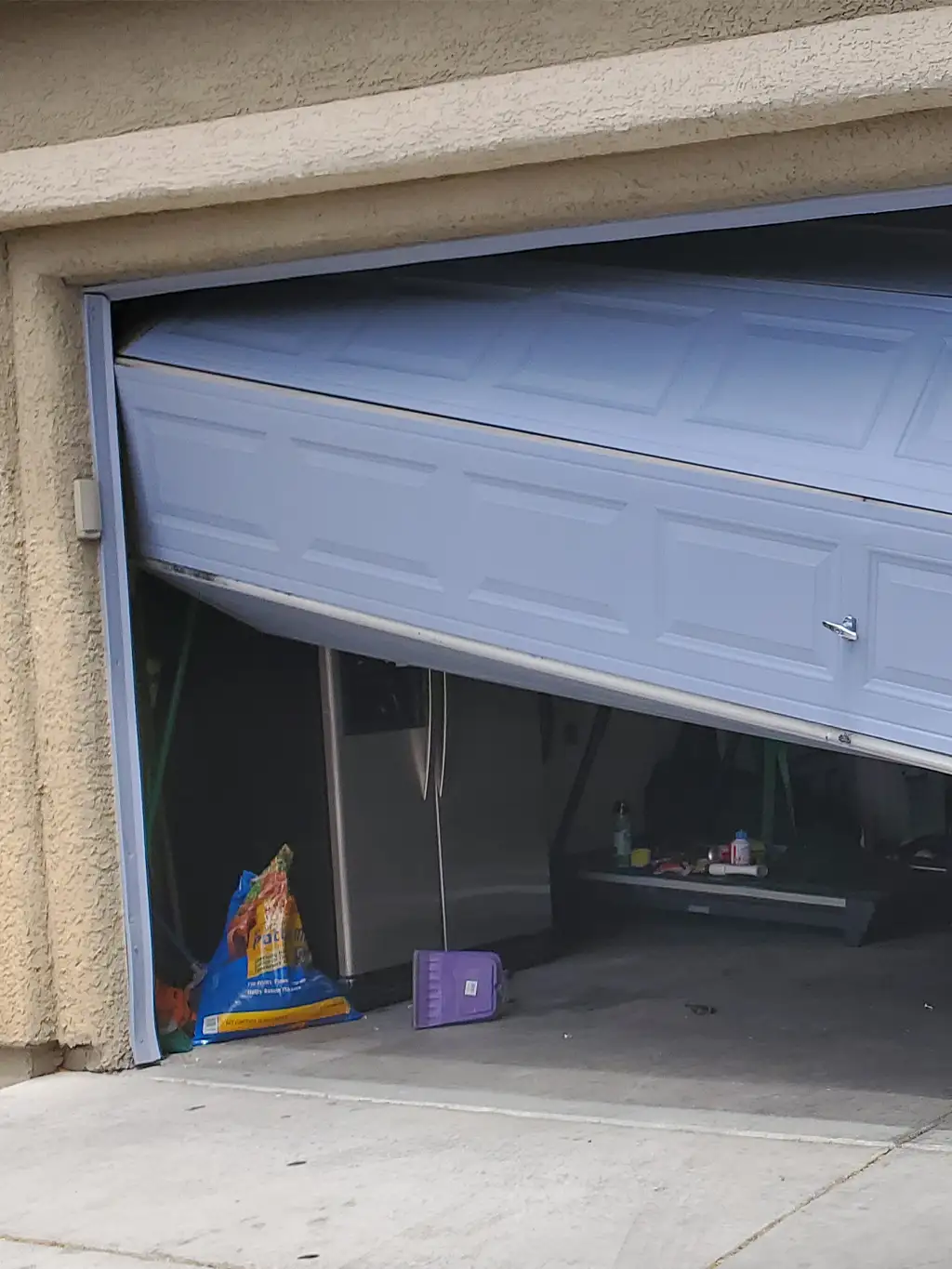 garage door off the track dallas tx